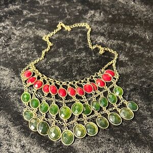 Elegant Gold Necklace with Red and Green Accents